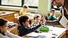 bild Pupils sitting at tables in a classroom.